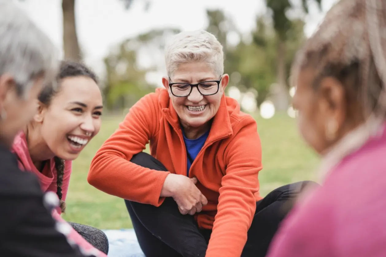 benefits of exercise at any age multigenerational group of women at park